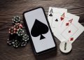 Poker play online. Poker chips and smartphone.
