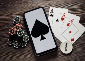 Poker play online. Poker chips and smartphone.