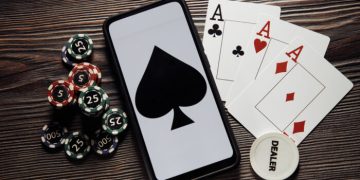 Poker play online. Poker chips and smartphone.